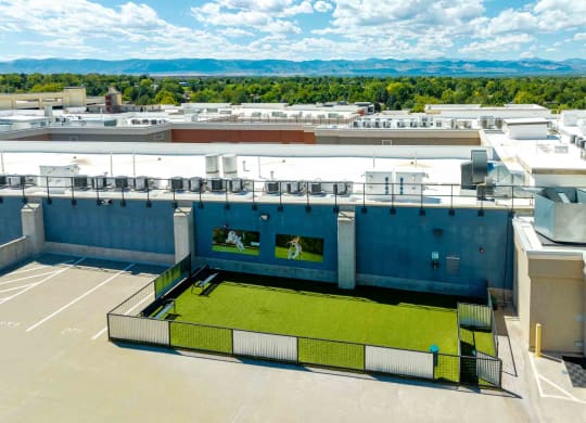 a tennis court on the roof of a building