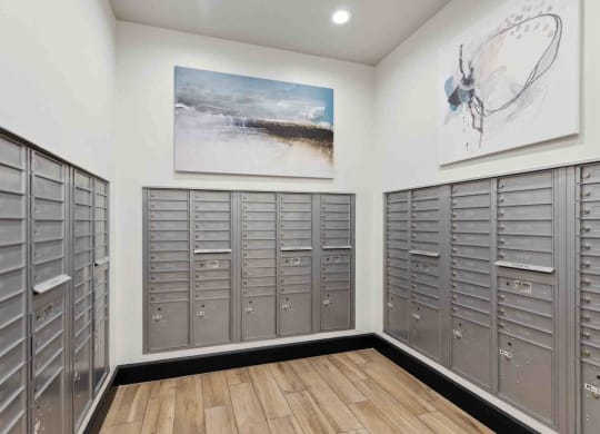 a large locker room with lockers and a painting on the wall
