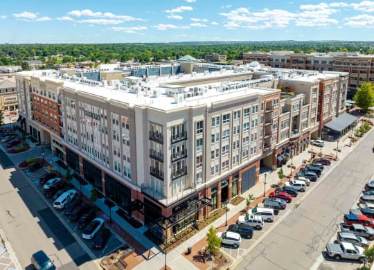 an aerial view of a large apartment building in a city