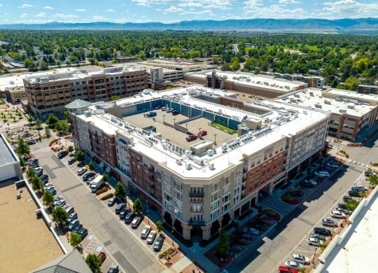 an aerial view of a large building in the middle of a city