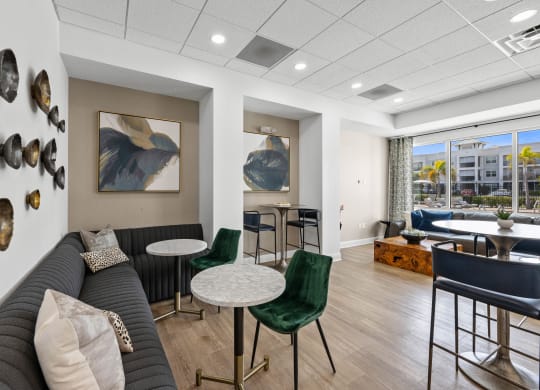 resident seating area with a couch and chairs and a table