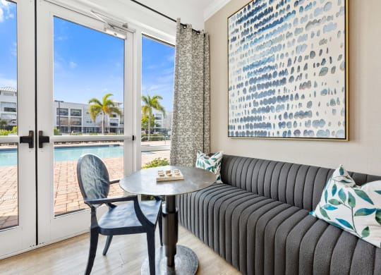 communal living room with a couch and a table and a pool