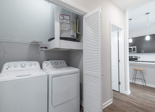 A laundry room with a washer and dryer.