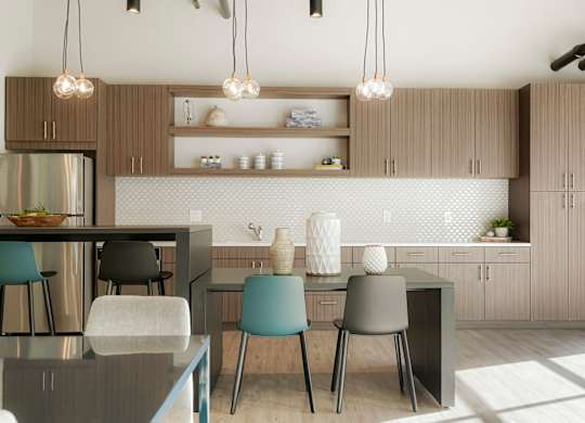 A modern kitchen with a dining table and chairs.