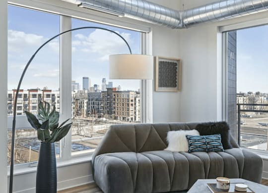 Furnished living room with view of downtown Minneapolis