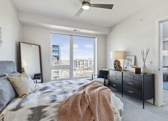 Furnished bedroom with ample lighting