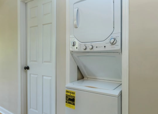 a washer and dryer are located in the laundry room