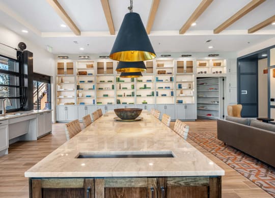 a large kitchen with a long island and a dining table
