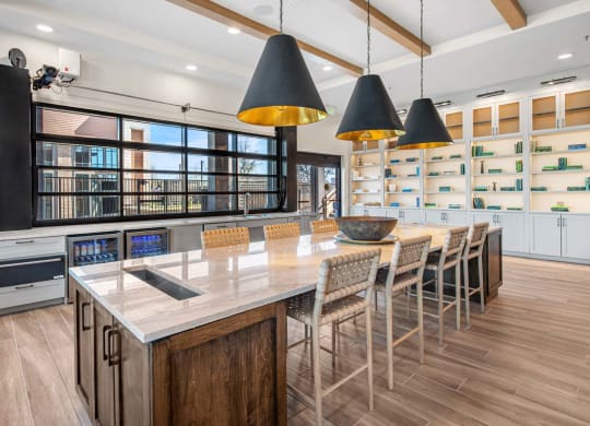 a large kitchen with a long table and chairs