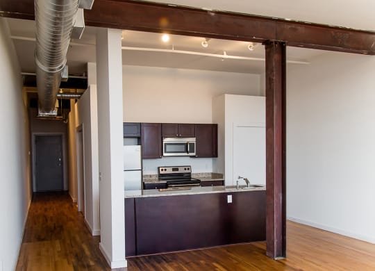 a view of the kitchen and living room from the dining room