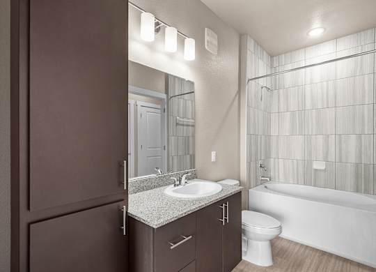 a bathroom with a sink toilet and a shower