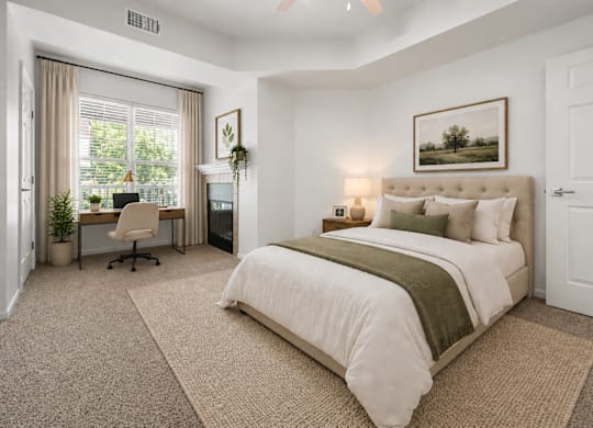 A bedroom with a large bed, a desk with a chair, and a window with curtains.