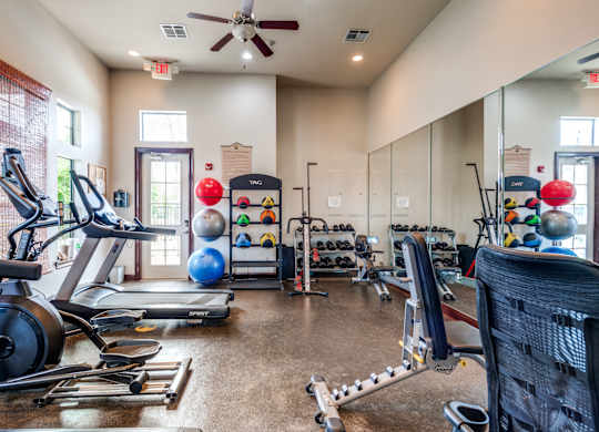 the gym with cardio equipment at the belgard apartments mn