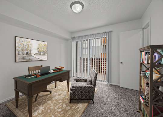 A room with a desk, chair, and bookshelf.