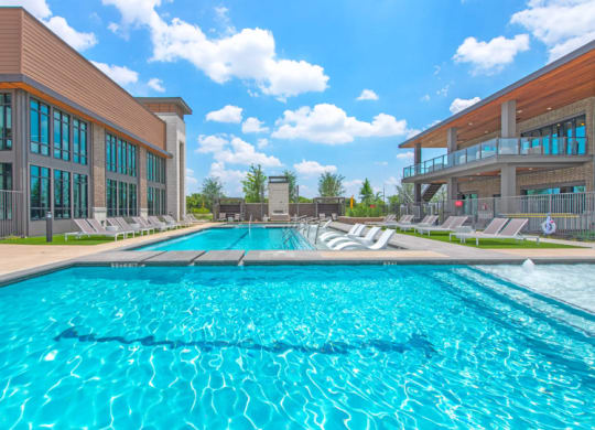 a swimming pool with a building in the background