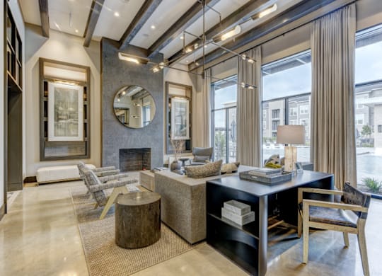 A modern living room with a fireplace and a large mirror on the wall.