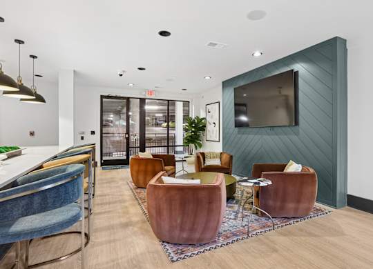 A modern living room with a blue chair and a wooden table.