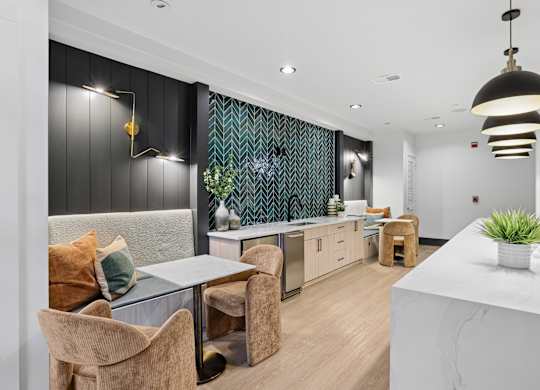 A modern kitchen with a dining table and chairs.