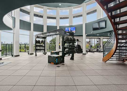 A gym with a treadmill, exercise bike, and other equipment.