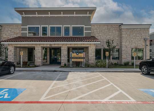 a building with a parking lot in front of it
