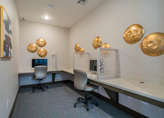 a view of a room with computers and gold balls on the wall