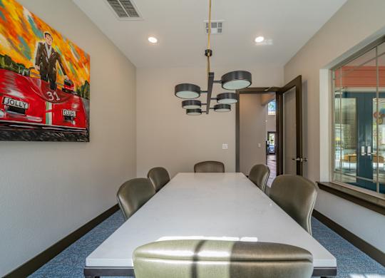 a conference room with a long table and chairs
