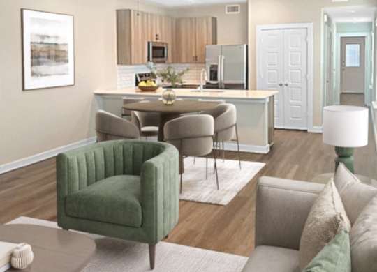 A living room with a green chair and a grey couch.