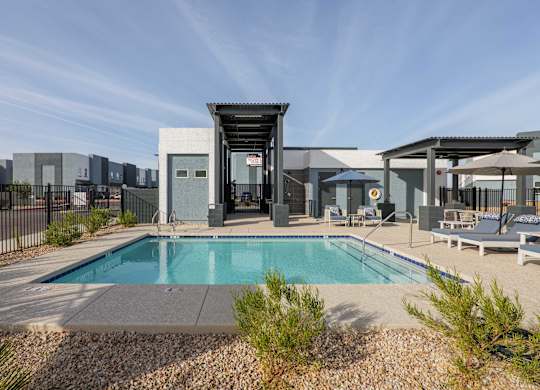A modern house with a pool in the backyard.