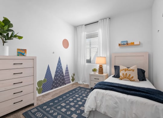 a bedroom with a bed and a dresser