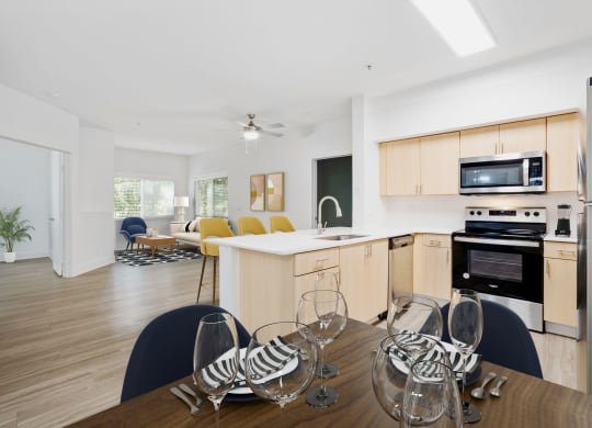 A spacious dine in kitchen with a table and chairs