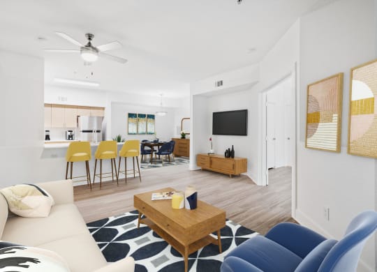 A living room with modern decor and plank flooring