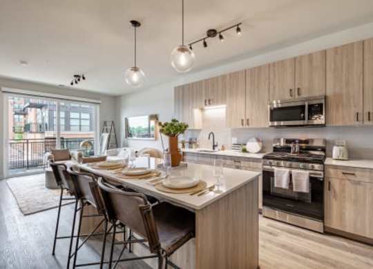 A modern kitchen with wooden cabinets and a large island.