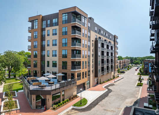 A modern apartment building with a courtyard in the middle.