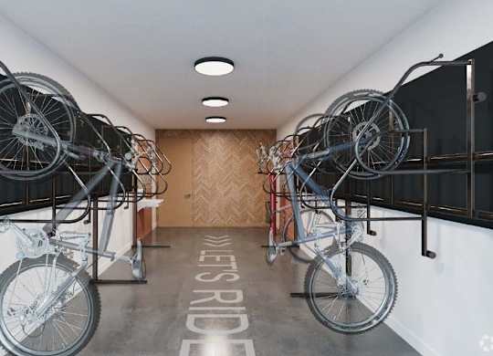 a room with two bikes hanging from the ceiling in a building