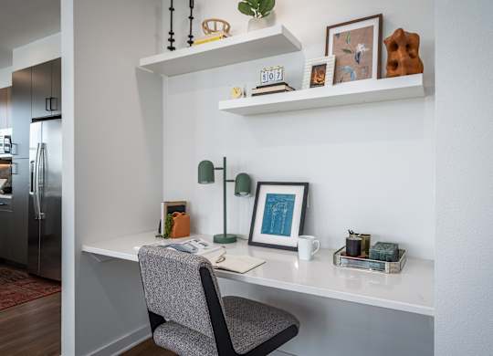 a home office with a desk and a chair