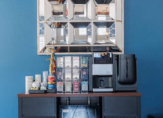 A black fridge with a large window on the front and a smaller window on the top.