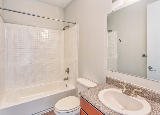 a bathroom with a sink toilet and bathtub