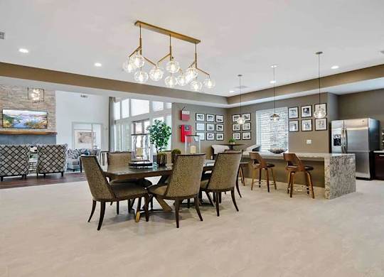 A dining room with a table set for six.