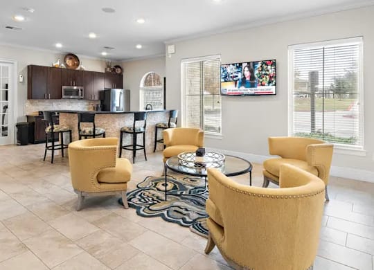 A living room with a bar area and a television.