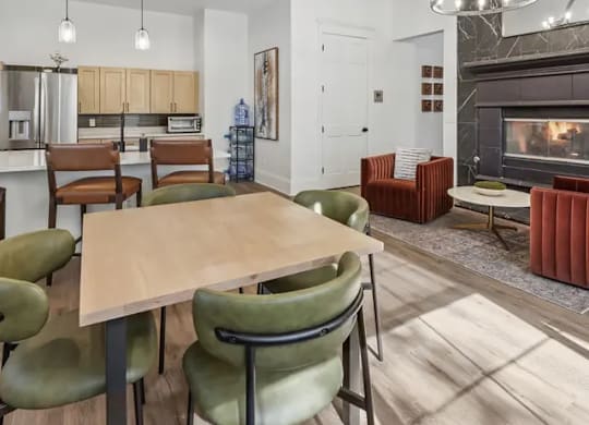 A modern dining room with a wooden table and green chairs.