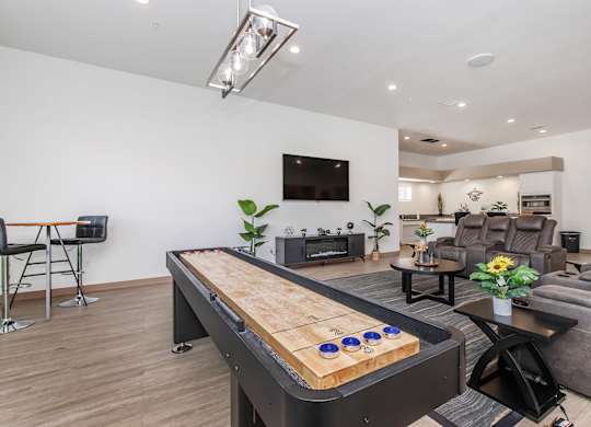 A shiny pool table in a well lit room.