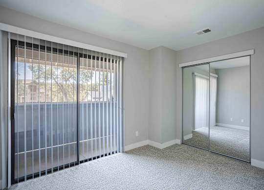the master bedroom has sliding glass doors to the patio