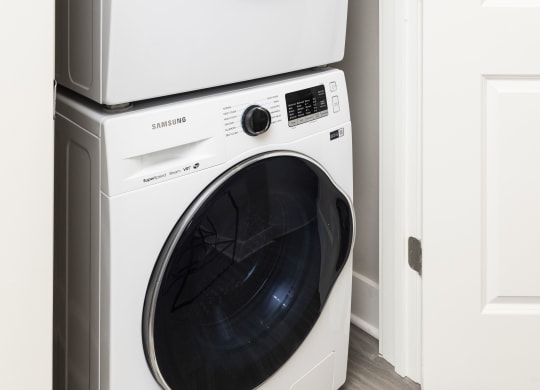 a white washer and dryer in a laundry room