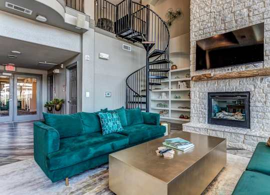 a fireplace with a tv above it and a couch and coffee table in front of it