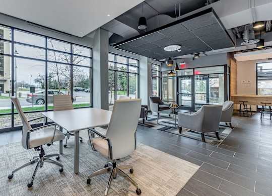 A conference room with a table and chairs.