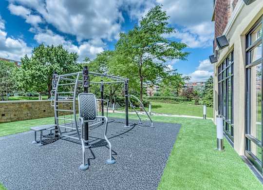 A playground with a slide and a climbing frame.