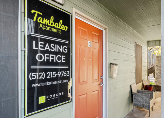 the front door of a building with a leasing office sign