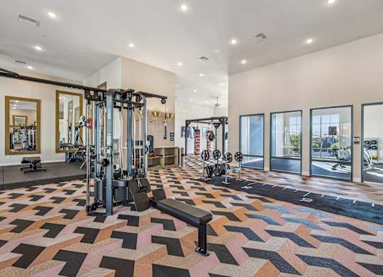 A gym with a variety of equipment at Fora Apartments, Las Vegas, NV 89183