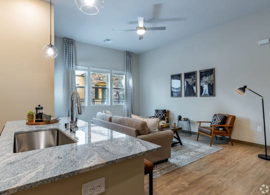Kitchen island with  granite countertop at Brownstone Apartments, Las Vegas, 89131