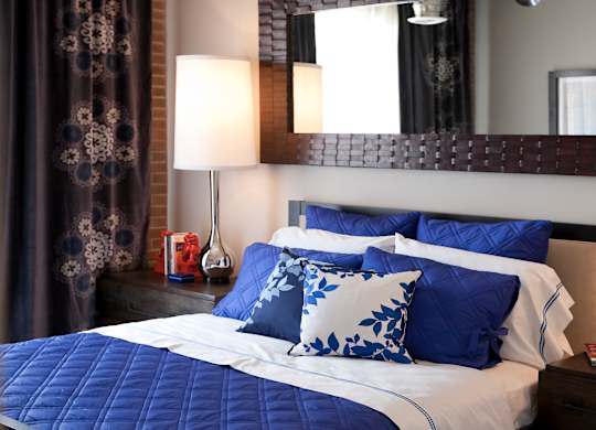 Bedroom with Cozy bed at The Foundry, South Bend, Indiana